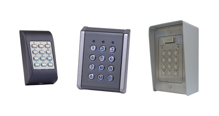 Three different types of keypads are sitting next to each other on a white background.