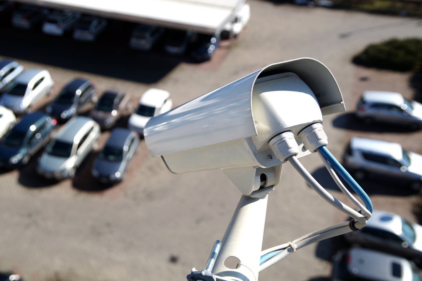 An aerial view of a security camera in a parking lot