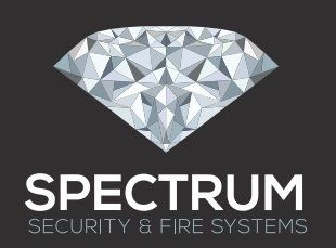 The logo for spectrum security and fire systems is a diamond on a black background.