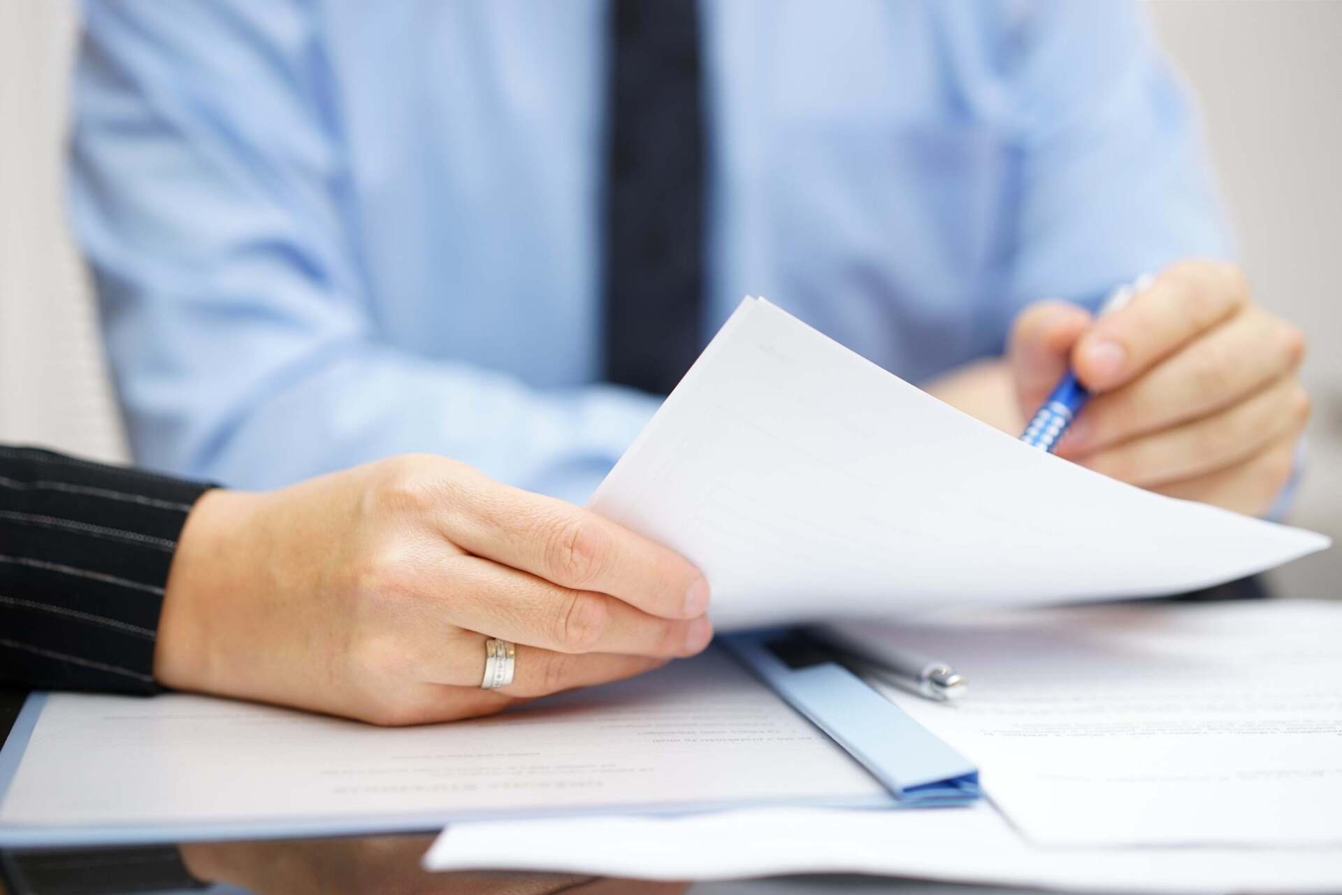 Financial Consultant Discussing A Document — Finance Broker in Darwin