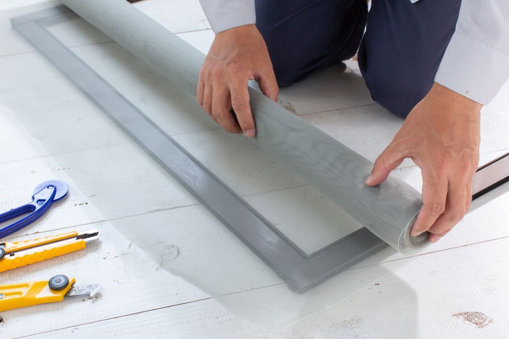 Hands of Person Repairing Window Screen — Coastal Screens & Glass in South West Rocks, NSW