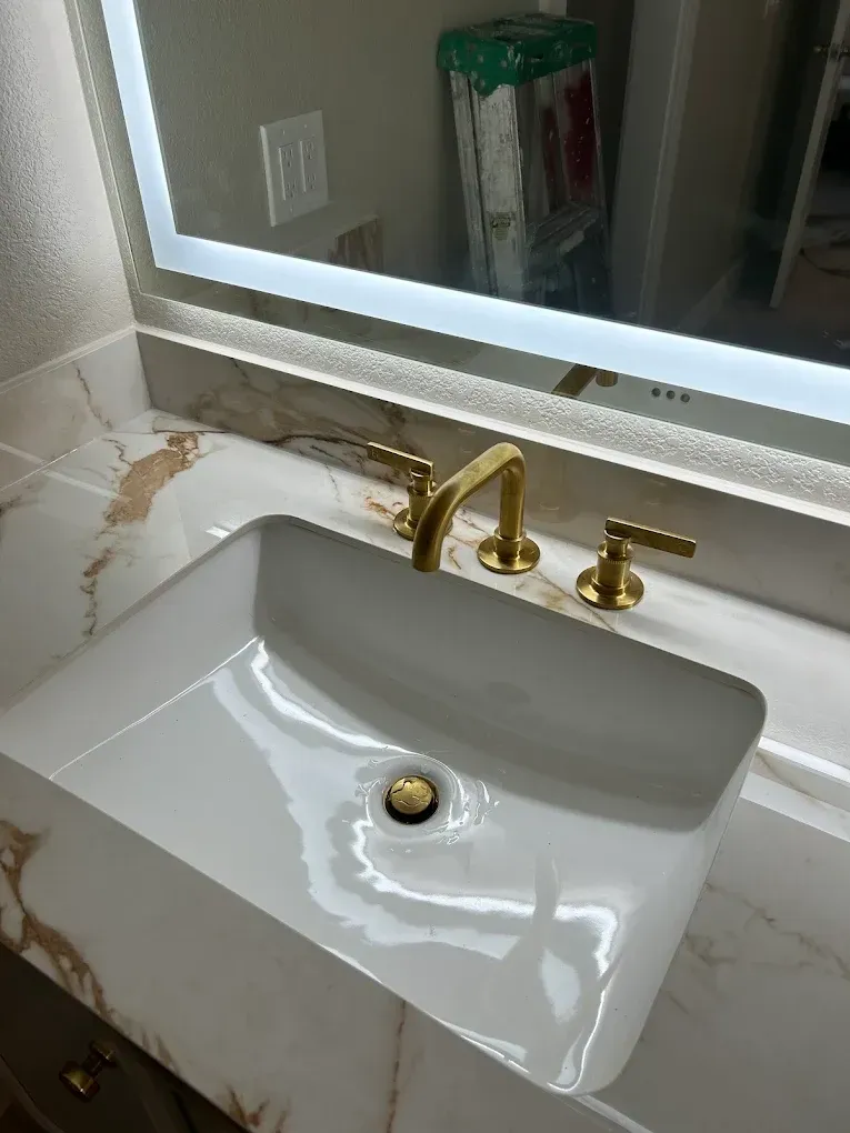 A bathroom sink with a mirror above it.
