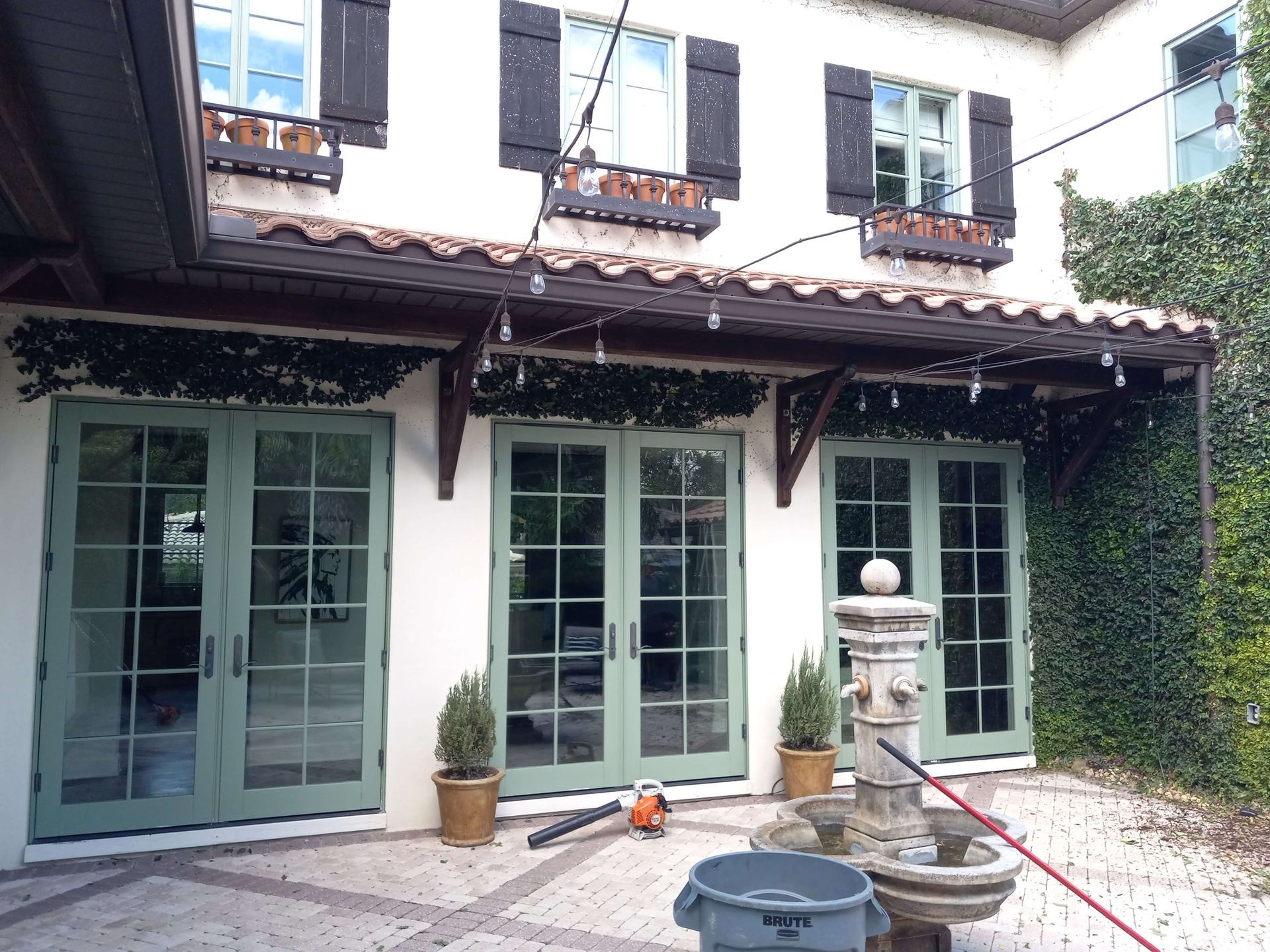 A house with a fountain in front of it