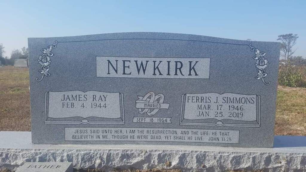 a gravestone with the name newkirk on it