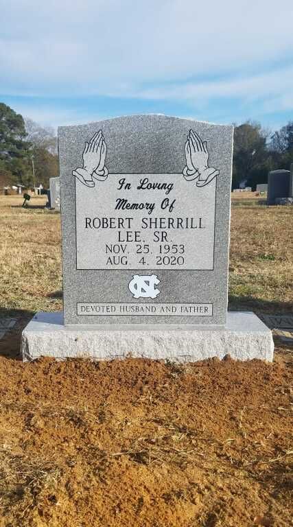 a gravestone for robert sherrill is in a cemetery .