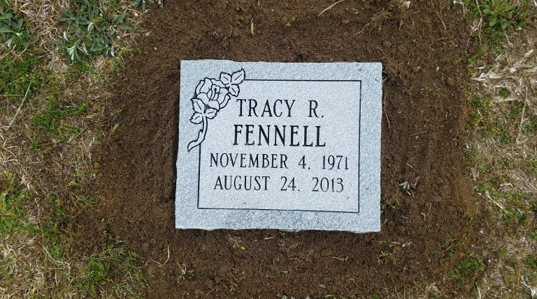 a gravestone for tracy fennell was placed in the dirt on august 24 2013