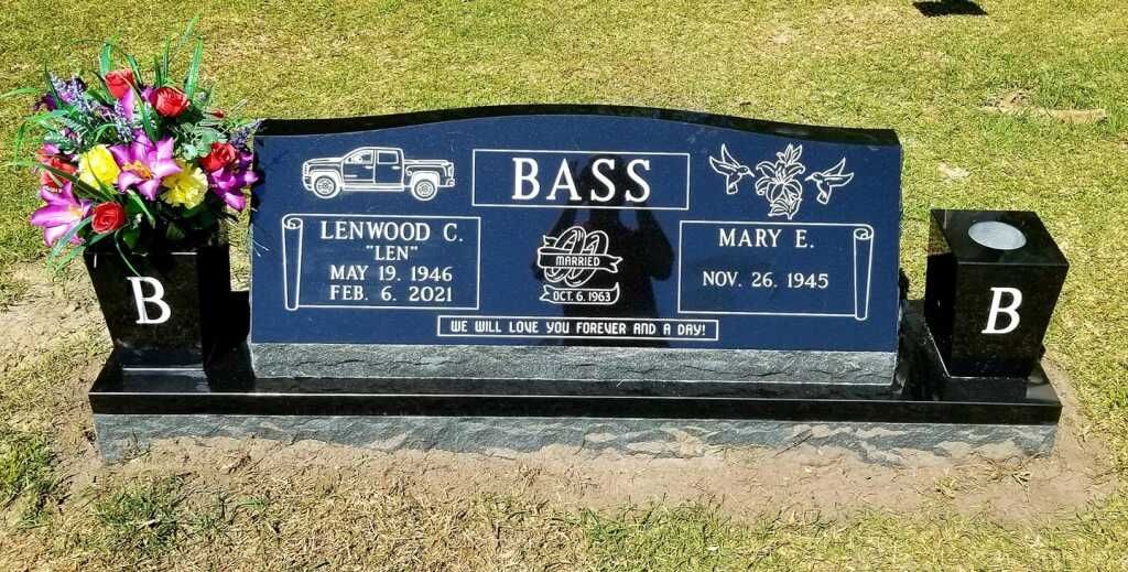 a blue gravestone with the name bass on it