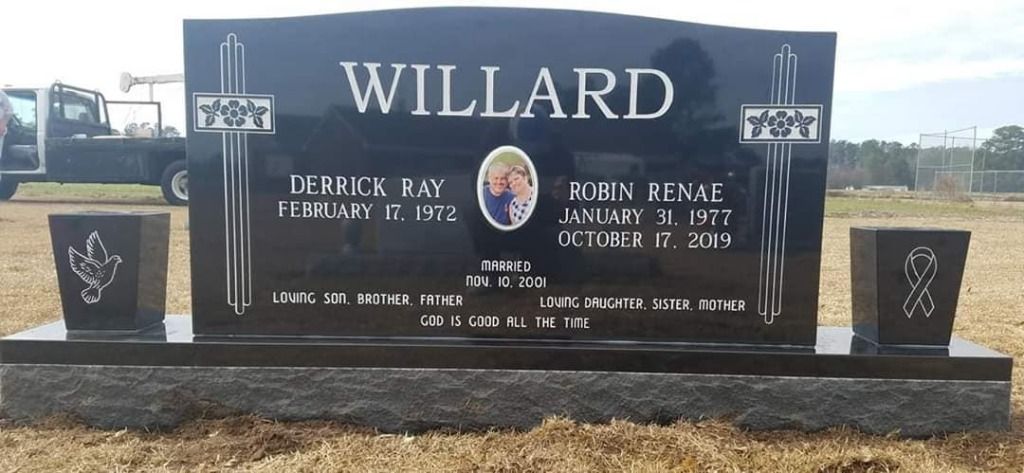a black gravestone with the name willard on it