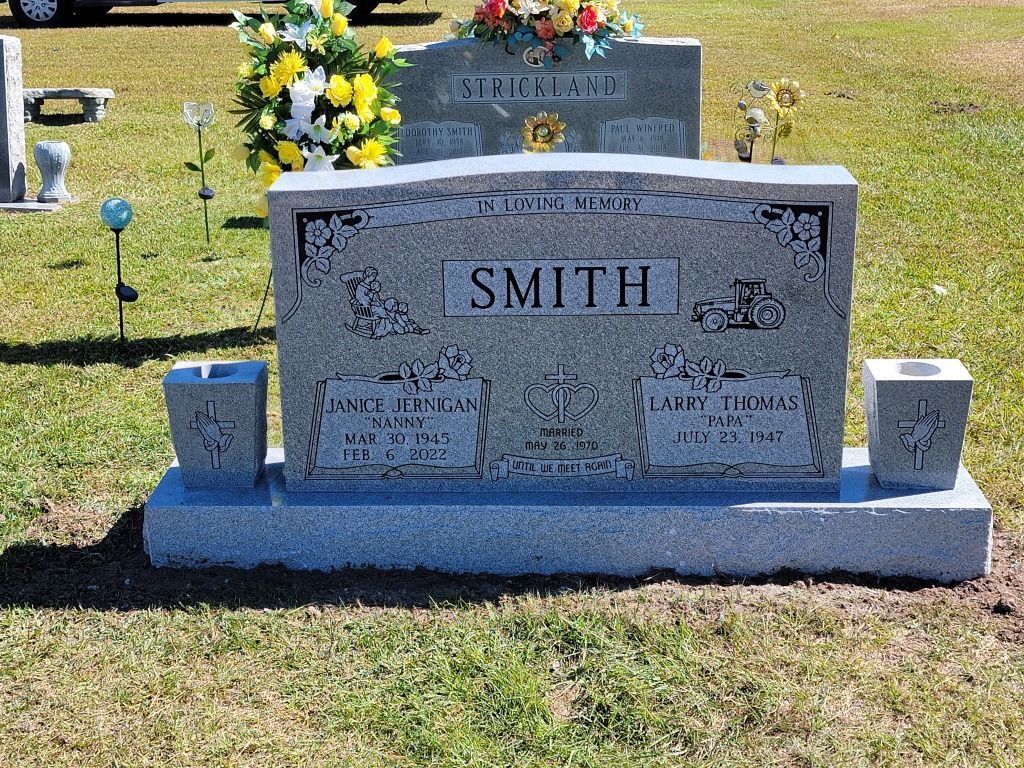 a gravestone with the name smith on it is in a cemetery .