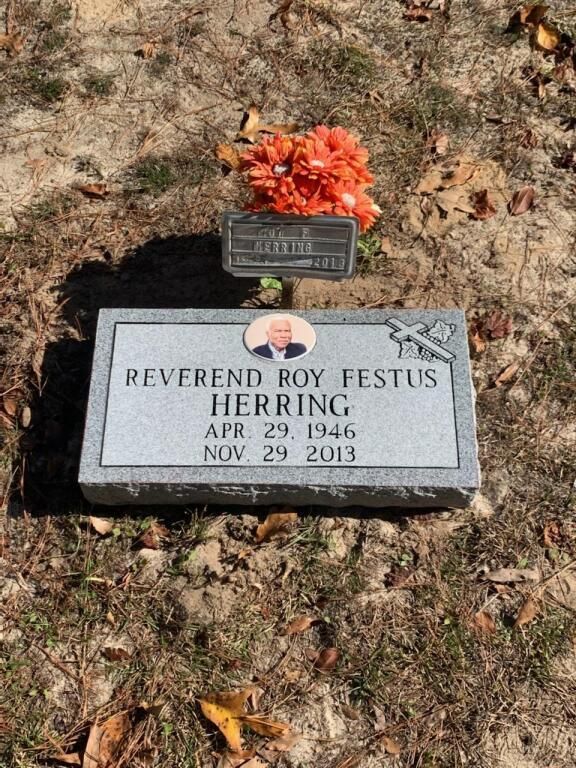 a gravestone for reverend roy festus herring