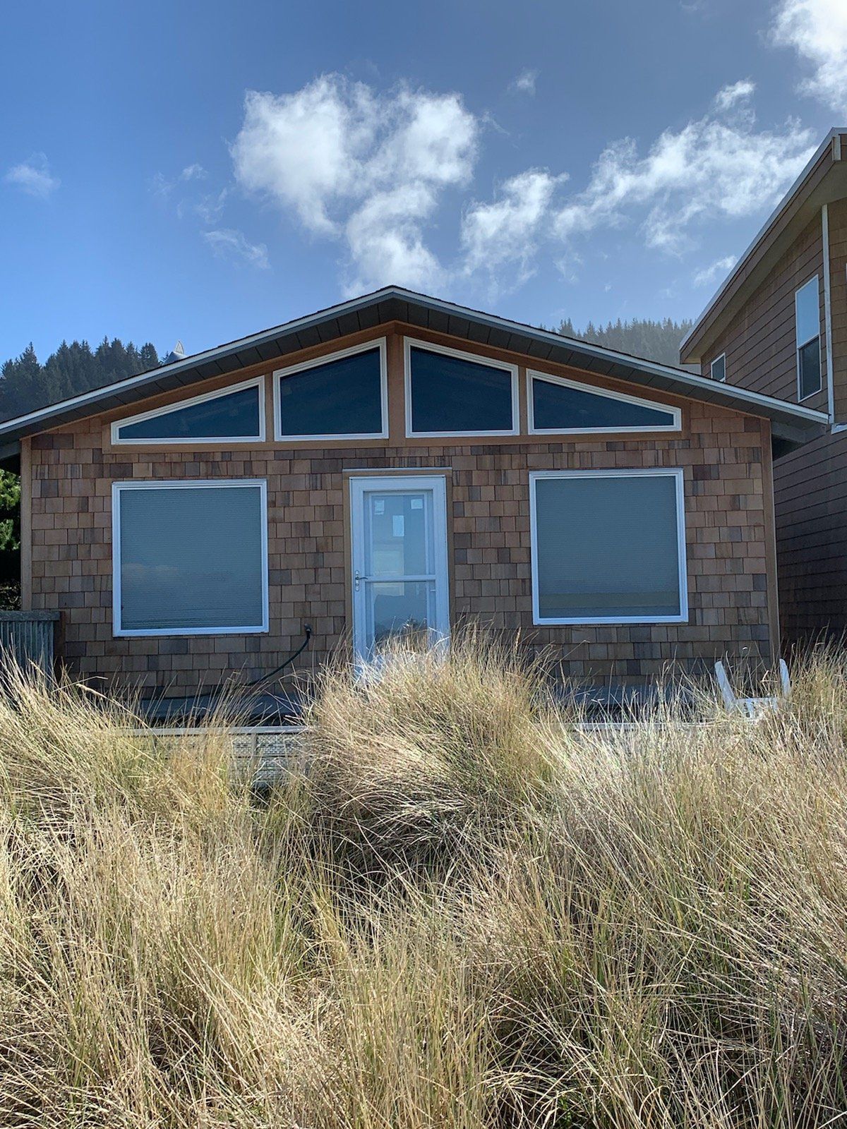 New siding, deck, staircase, and windows on a Tierra Del Mar home