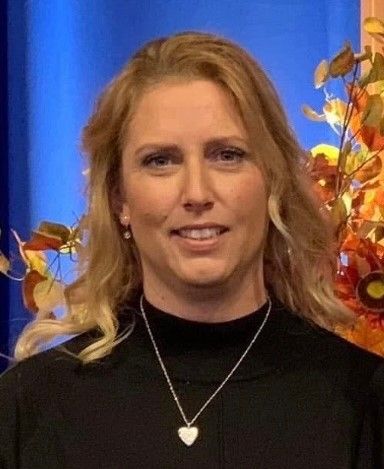 Gray silhouette of a person, head and torso visible, against a gray background.