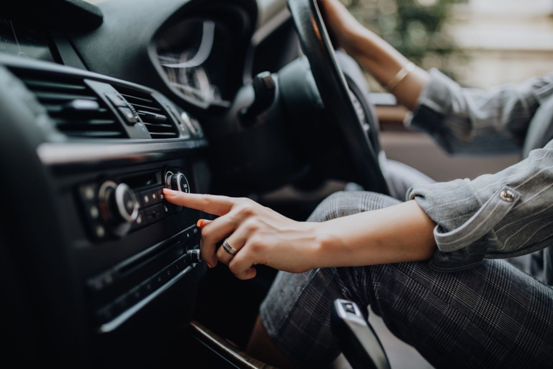 A Woman is Driving a Car and Adjusting the Radio — Alstonville Rego & Mechanical in Alstonville, NSW