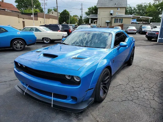 White GMC Sierra pickup truck parked on asphalt.