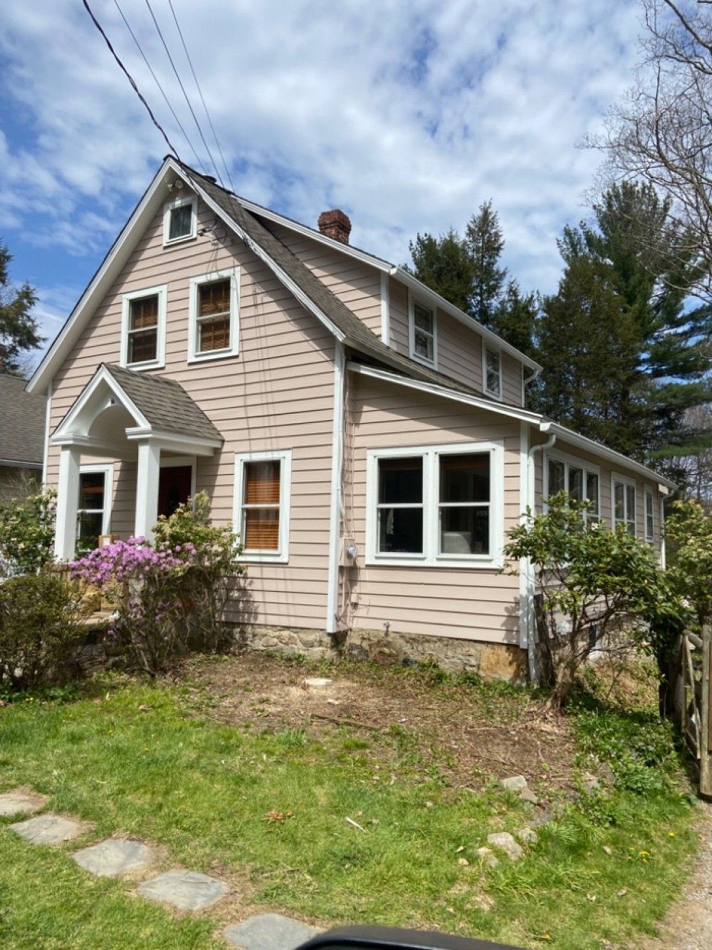 Contemporary modern home interior entry foyer with large glass and black doors.