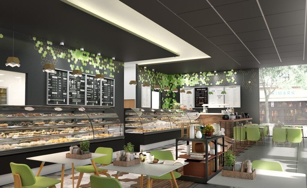 Modern bakery café with pastry displays, green chairs, and indoor plants under bright lighting