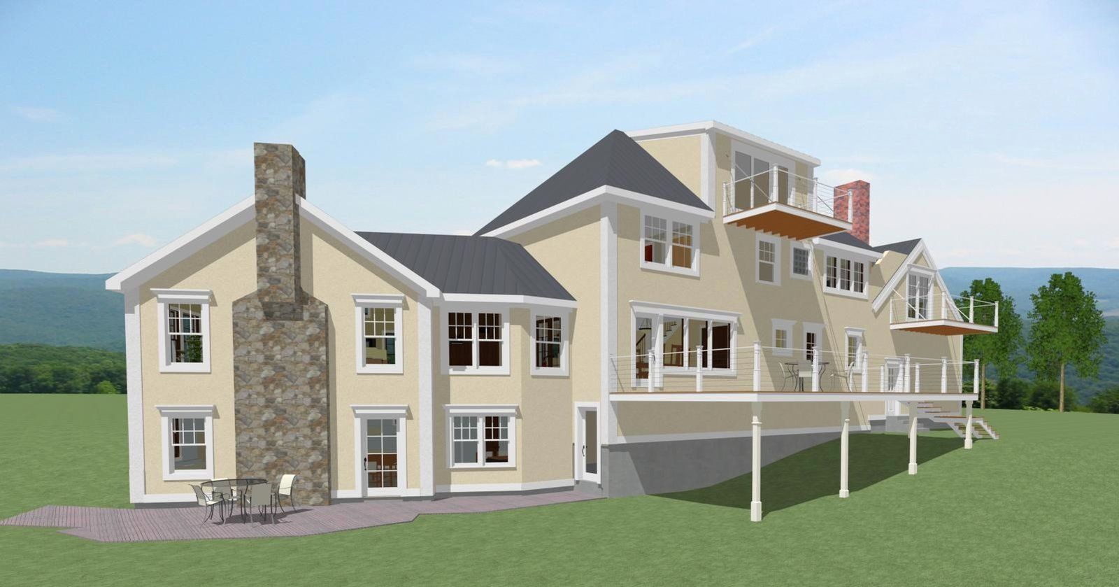 Two-story beige house with stone chimney, wraparound porch, and green lawn under a blue sky