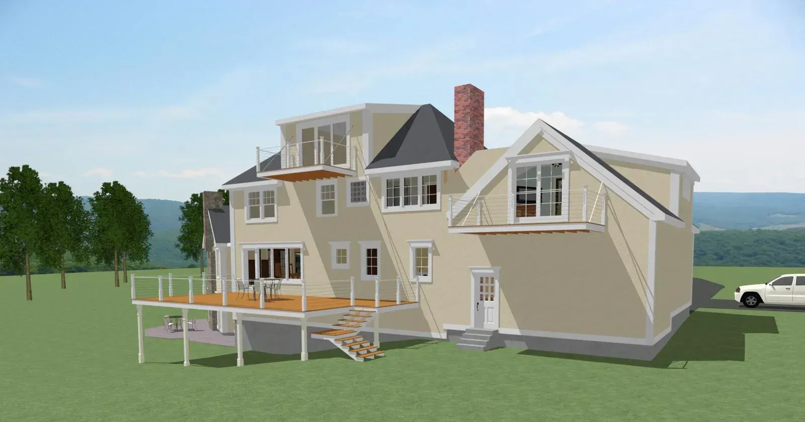 Beige house with a deck and chimney on a grassy hill overlooking water under a clear sky