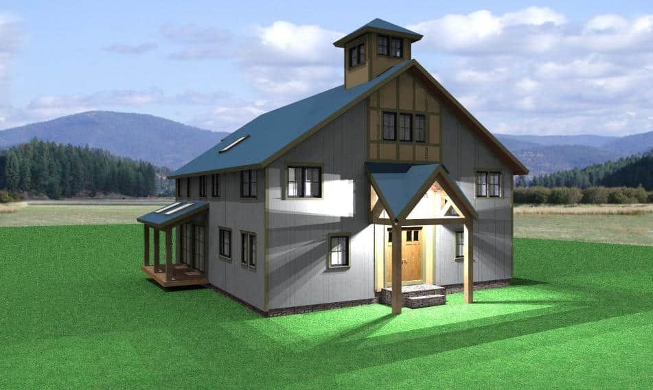 Modern two-story house with gray walls and dark roof on a green lawn, with mountains in the background