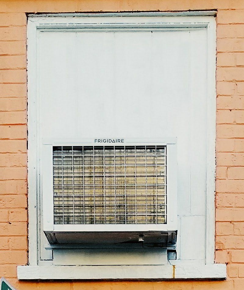 A Window with a Frigidaire air Conditioner in it - SIC Airconditioning & Refrigeration in Townsville