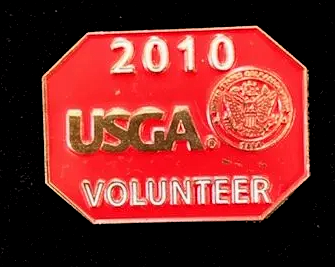 A red stop sign that says 2010 usga volunteer