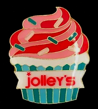 A jolley 's cupcake with pink frosting and sprinkles