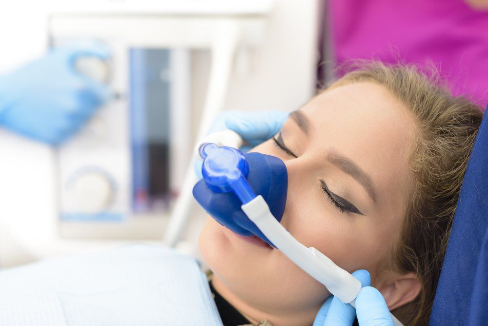 woman sleeping - nitrous oxide - sedation dentistry | Dentist Near Me Wellington