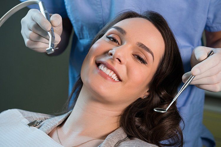 woman at the dentist, dental cleanings