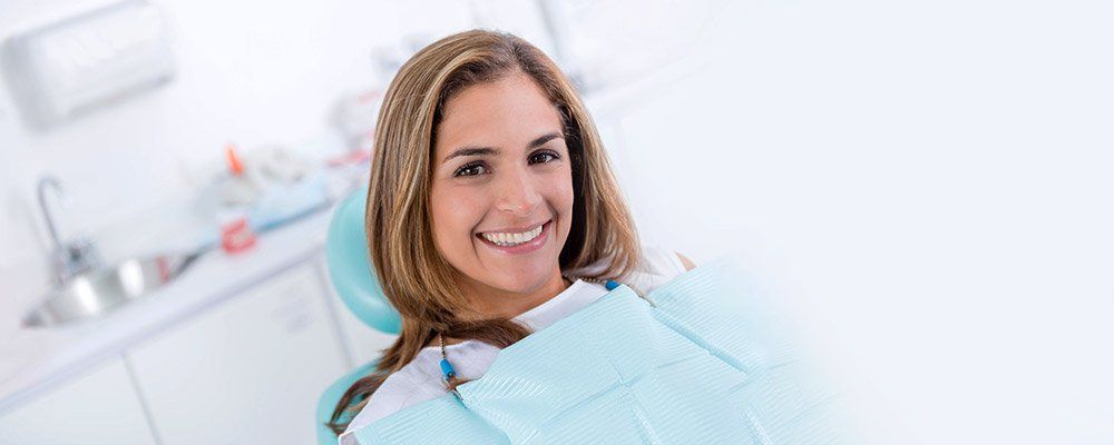 Middle age woman smiling - Dental services at Smile Designs | Cosmetic Dentist Wellington