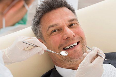 Older man at the dentist, general dentistry |  Prosthodontist In Wellington