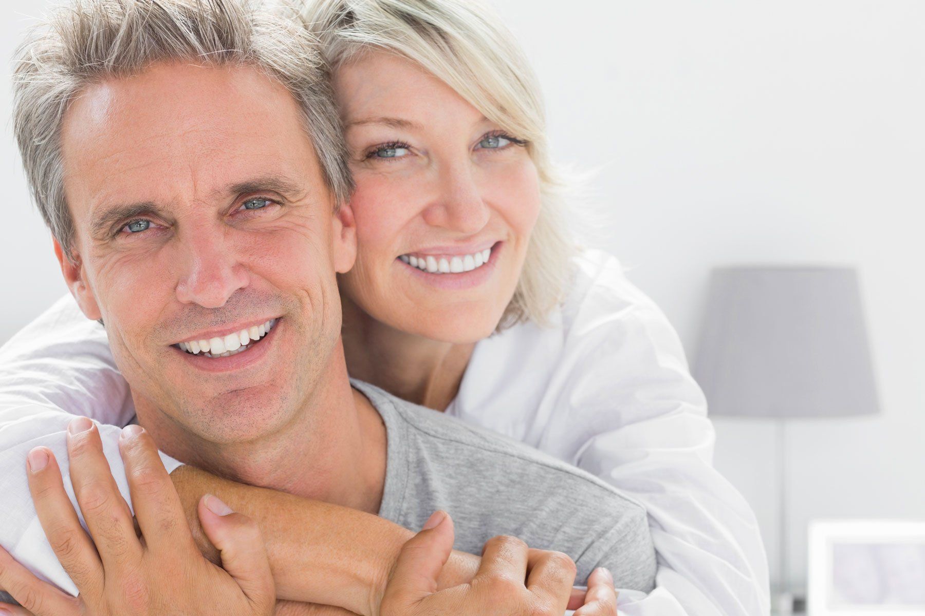 Late 40's couple with perfect smiles