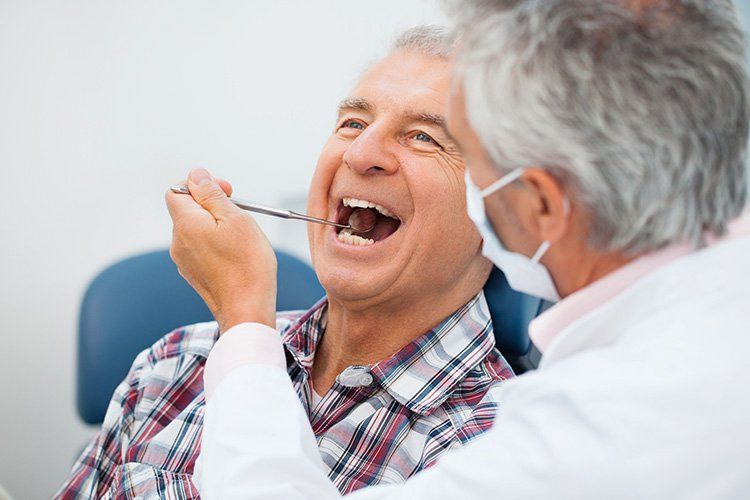 older man at the dentist, oral cancer screenings