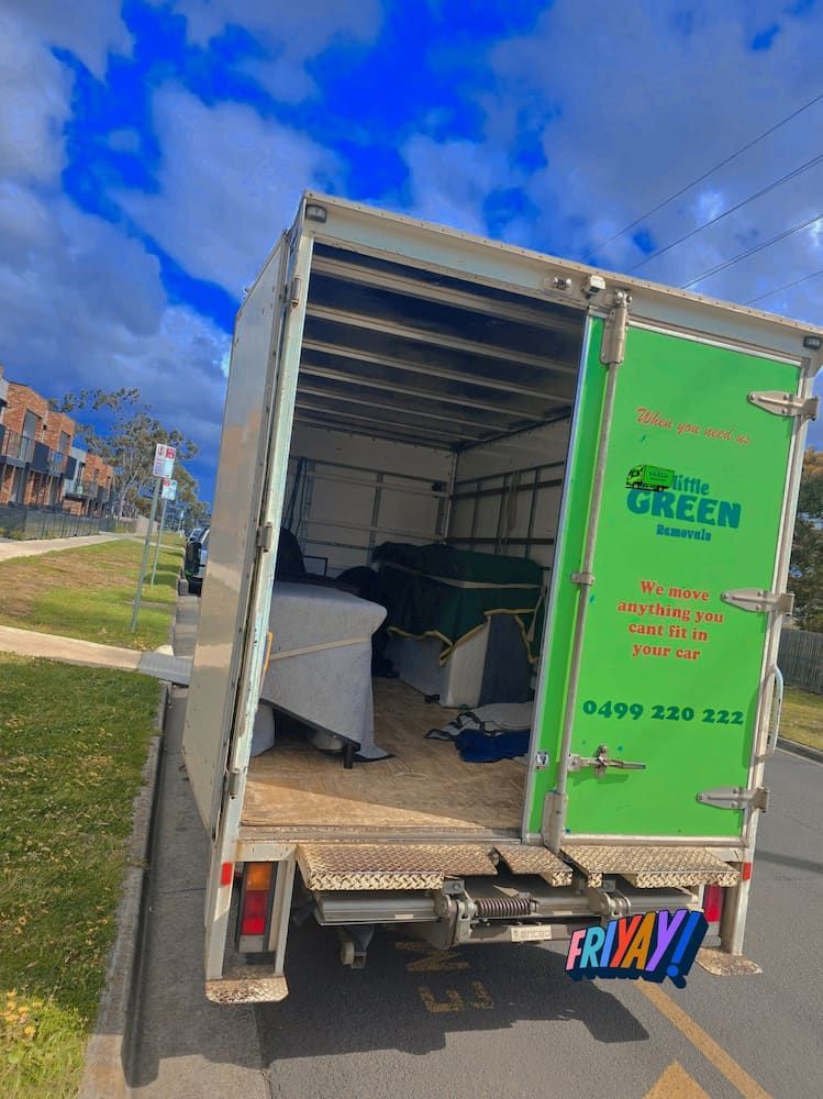 Open Moving Truck With Furniture Inside, Parked on a Grassy Roadside — Little Green Removals Geelong in Breakwater, VIC