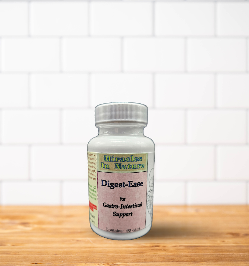 A bottle of digestive base is sitting on a wooden table.