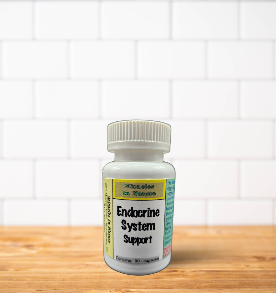 A bottle of endocrine system support is sitting on a wooden table.