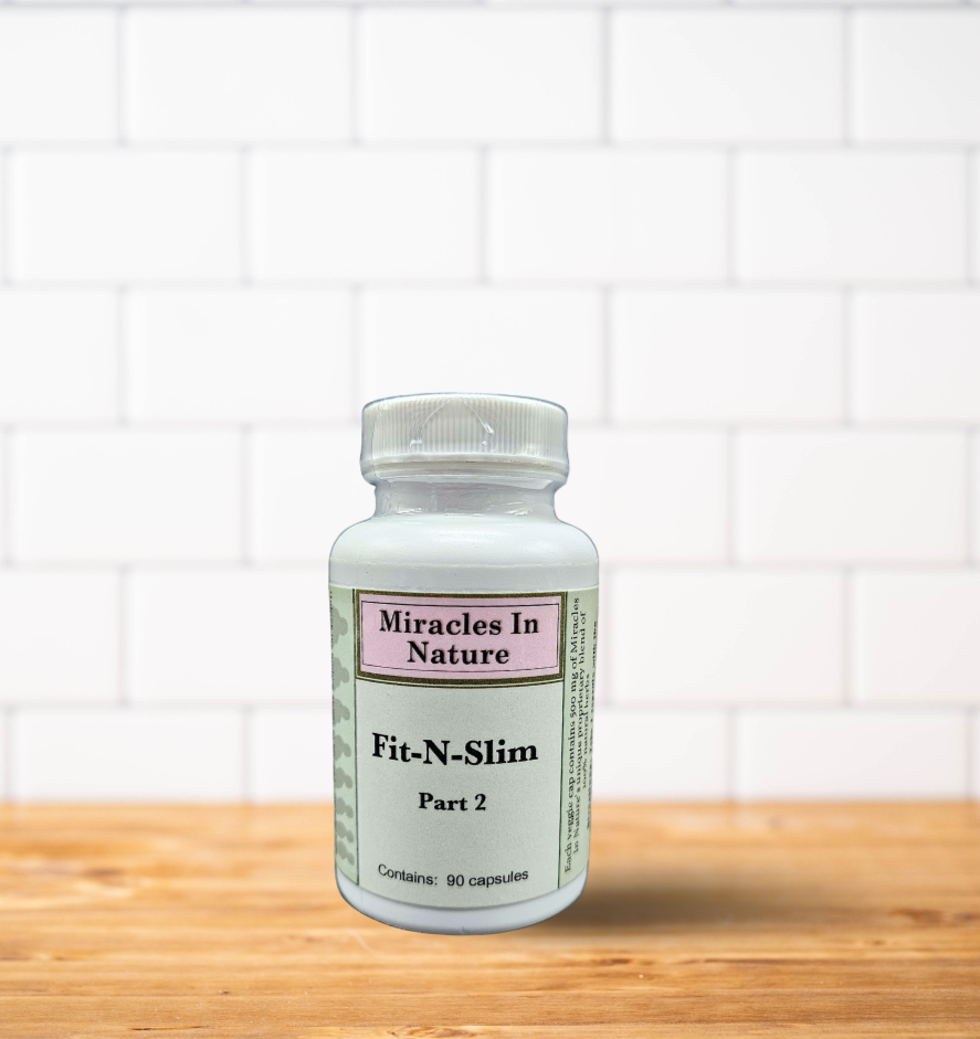 A bottle of fix n slim part 3 is sitting on a wooden table.