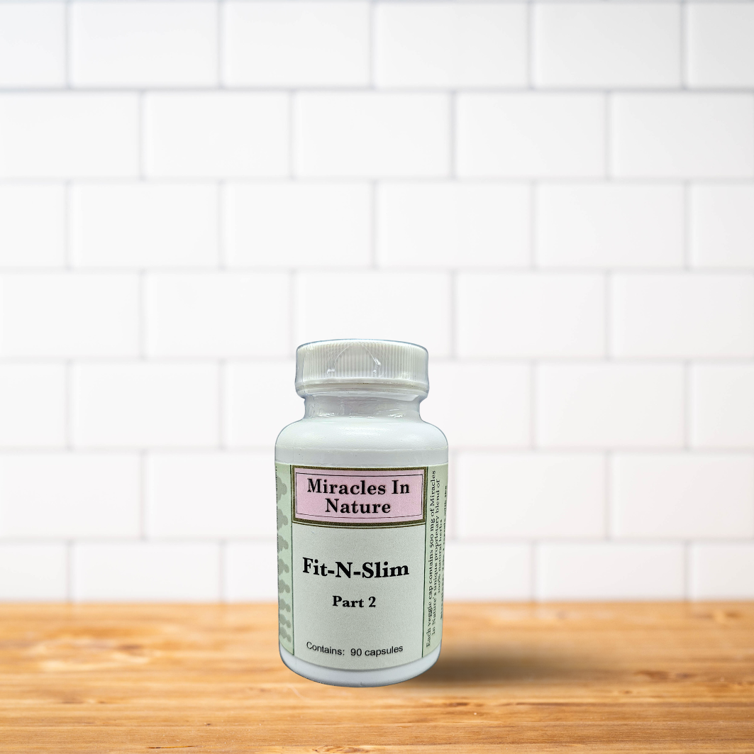 A bottle of miracles in nature fit-n-slim part 2 is sitting on a wooden table.