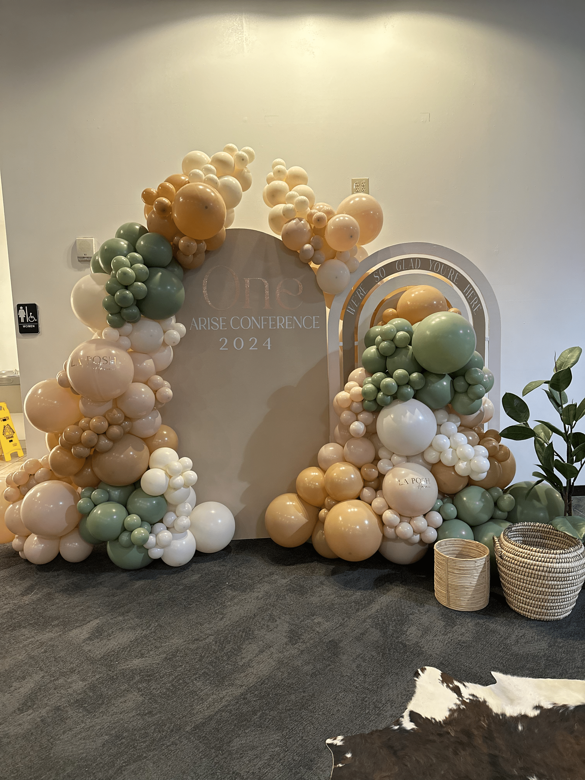 A room filled with lots of balloons and a rainbow.