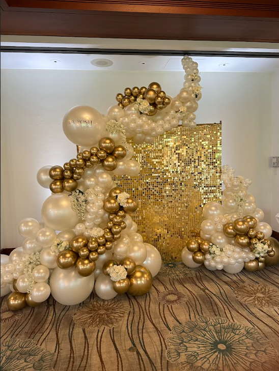 A bunch of balloons are sitting on the floor in a room.