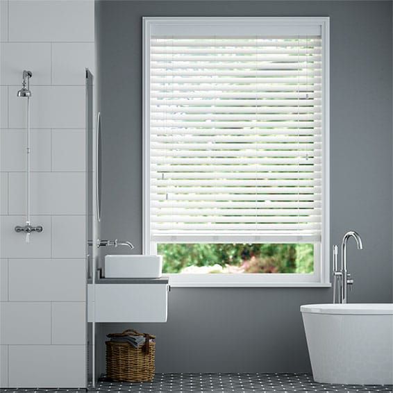 A row of white blinds on a blue background.