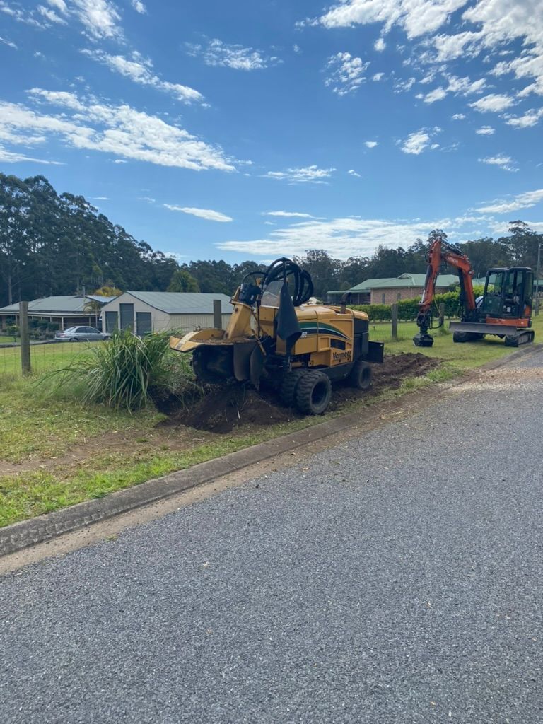 A stump grinding machines is being used — MNC Trees in Port Macquarie, NSW