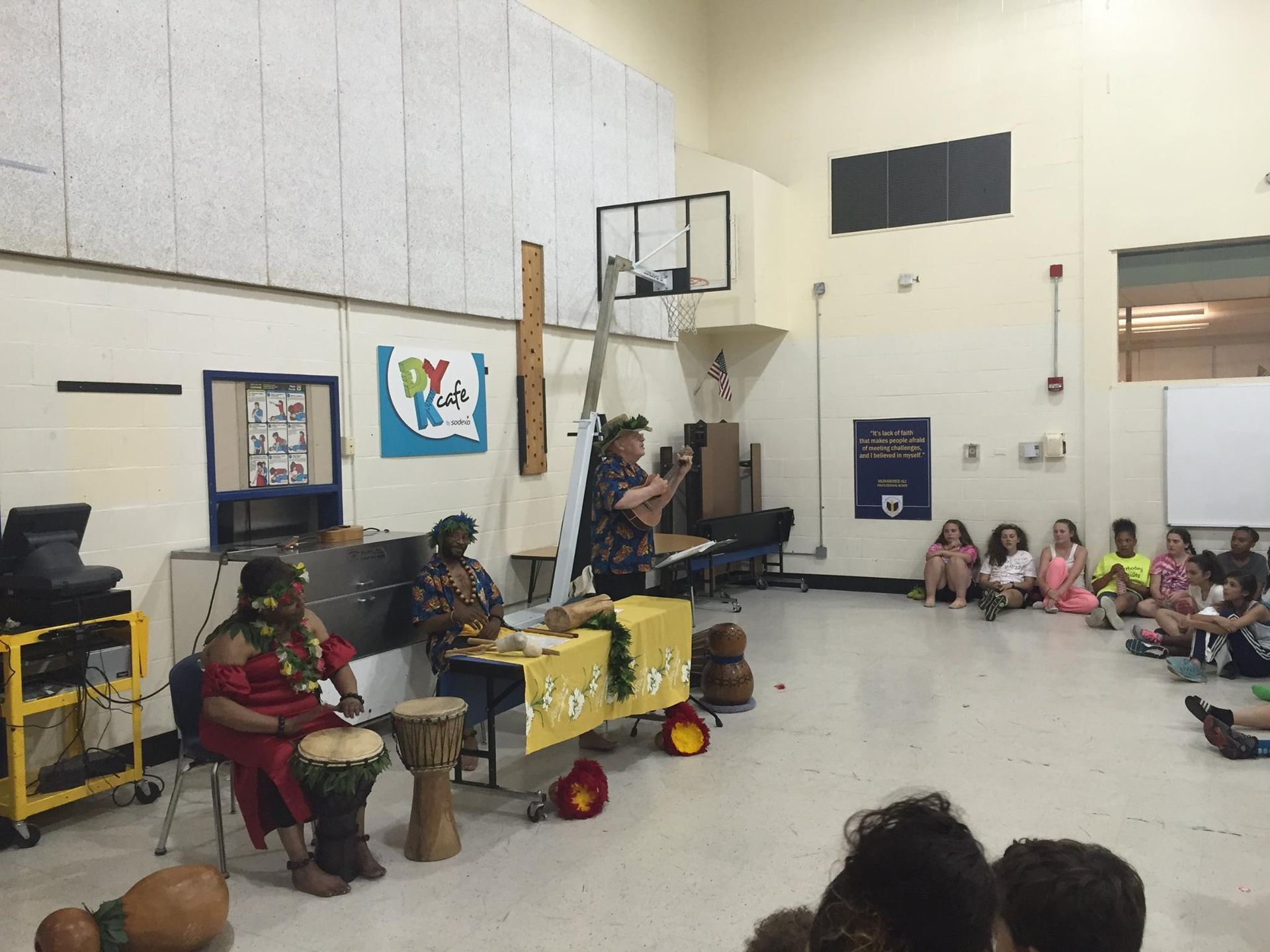 A group of people are sitting around a table in a room.