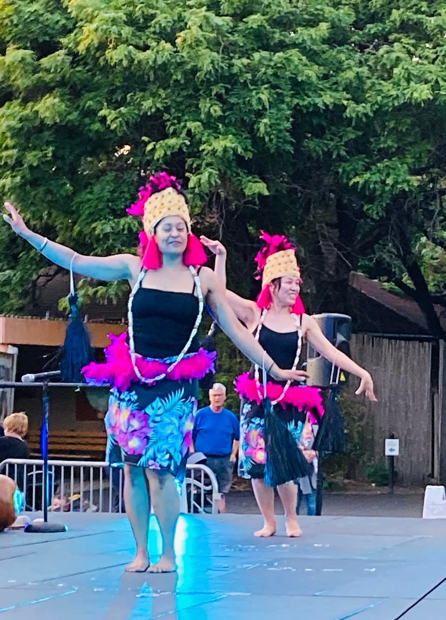 A group of women are dancing on a stage.