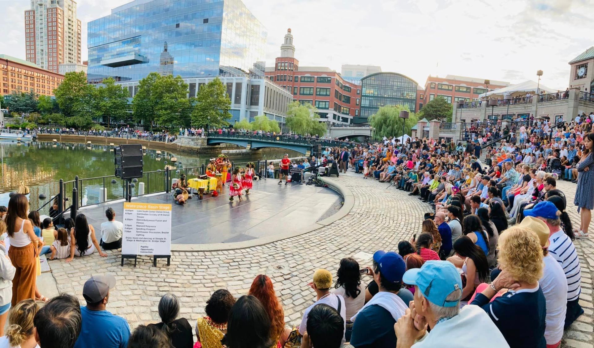 A crowd of people are watching a performance on a stage.