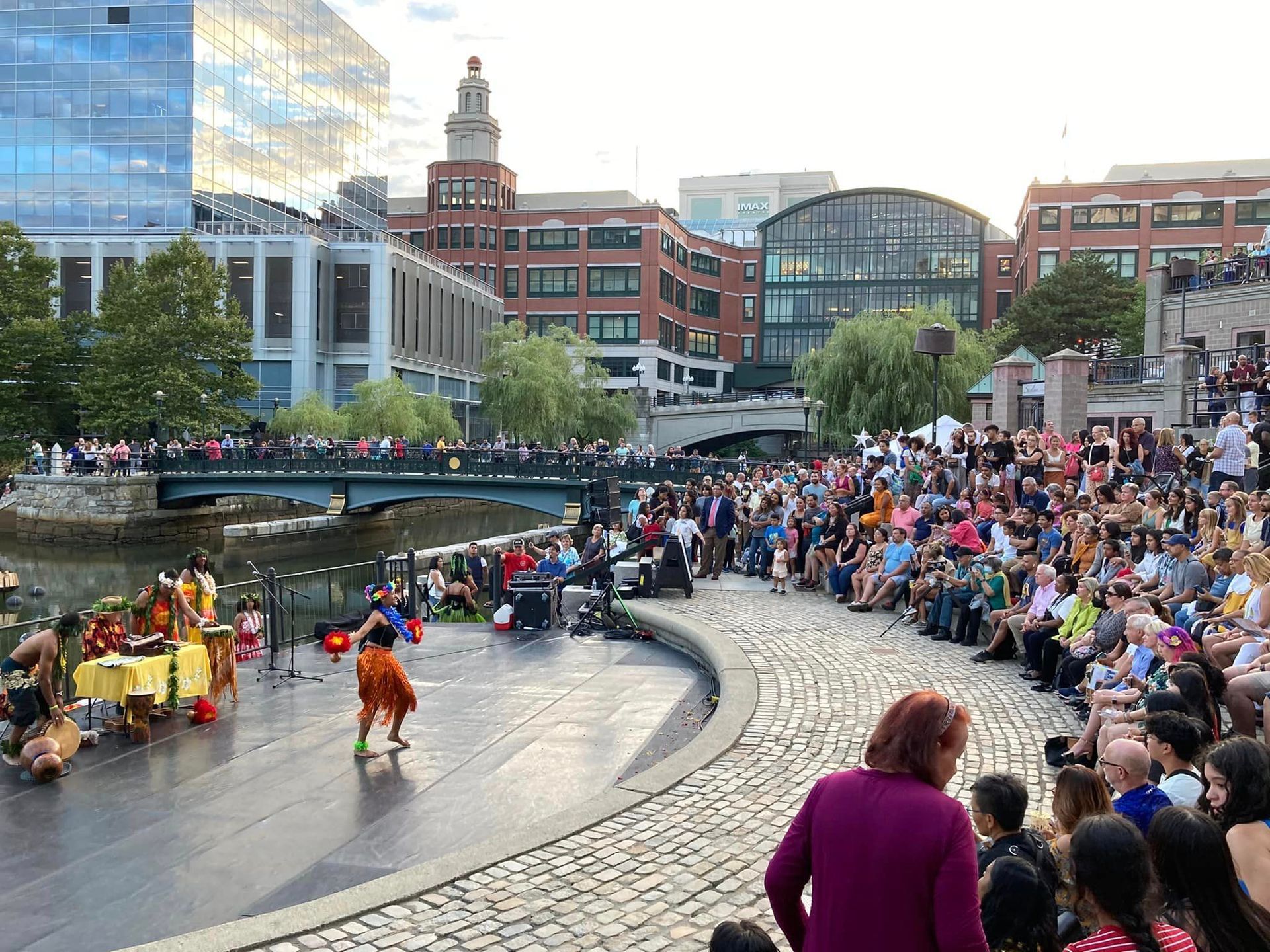 A crowd of people are watching a performance on a stage.