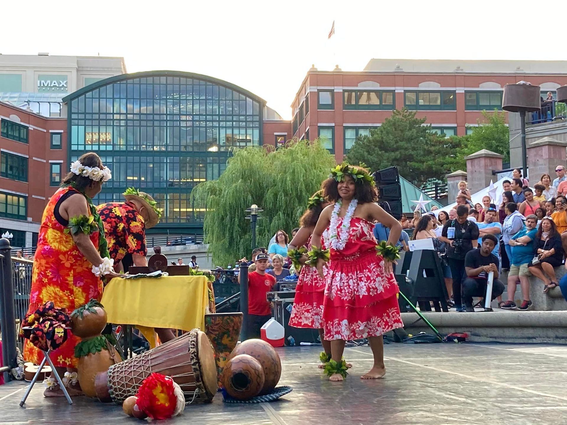 A group of women are dancing in front of a crowd.