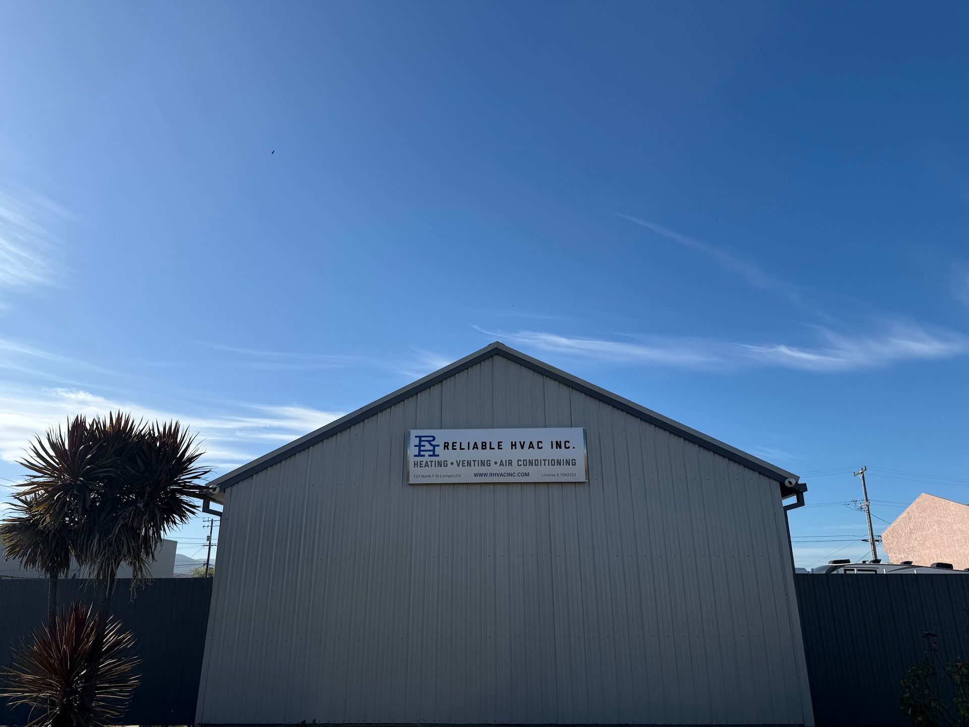 Gray building with sign for 