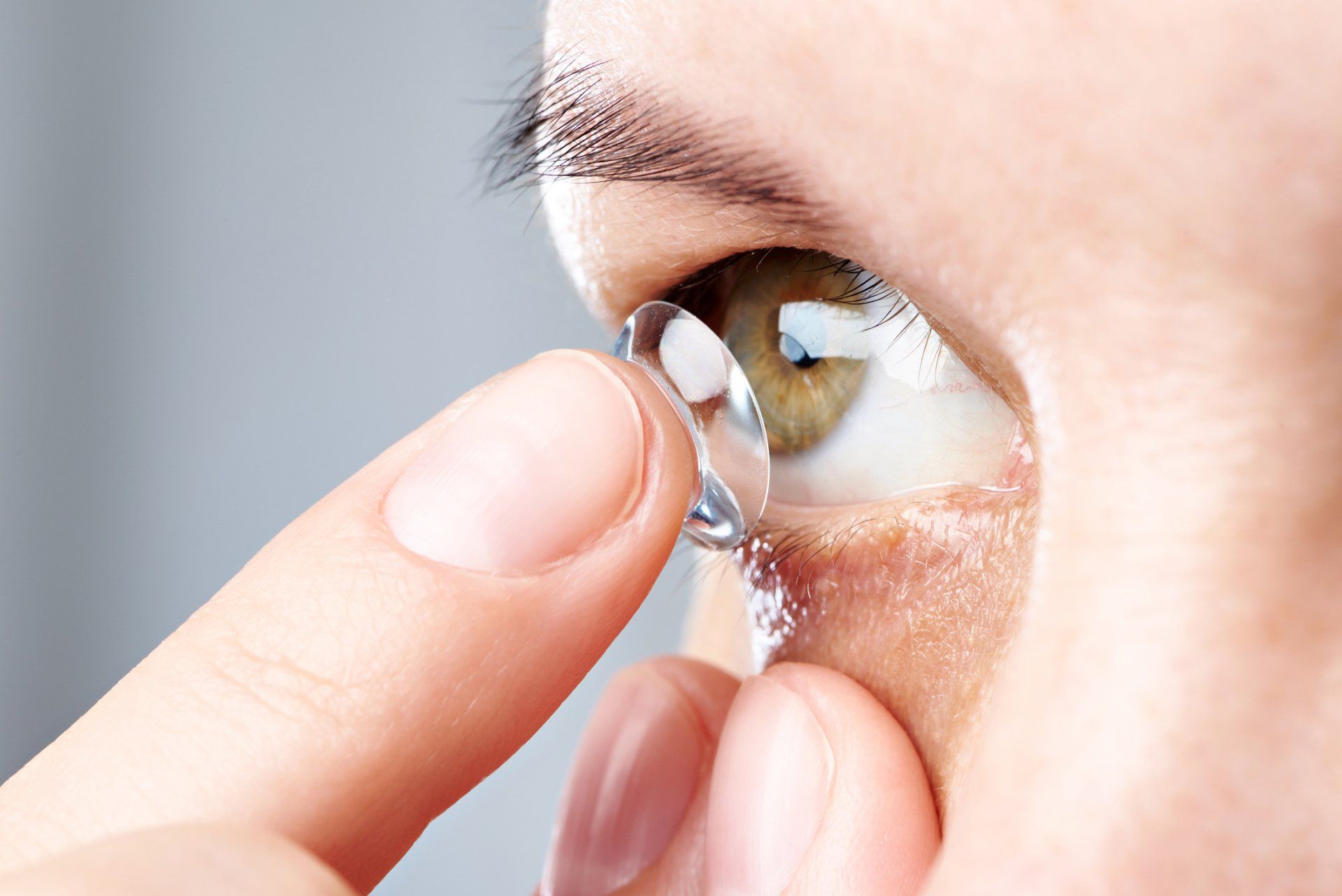 Custom Fit Contacts  — Woman Puts Contact Lens in Belleville, IL
