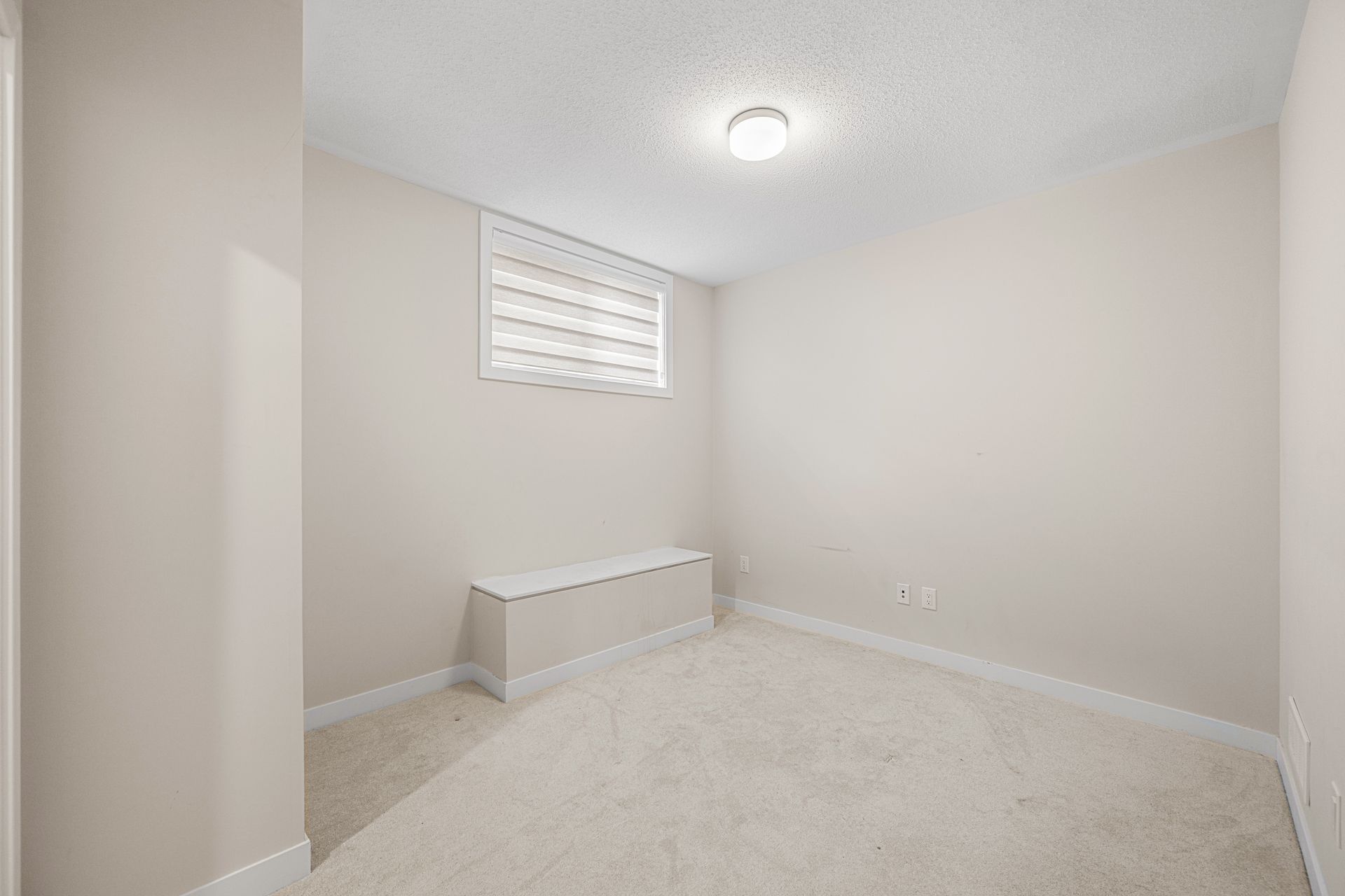 There is a window in the corner of the room.