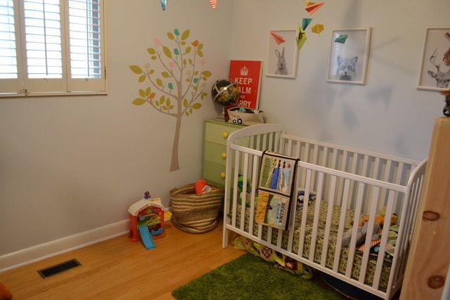 There is a crib in the middle of the room.
